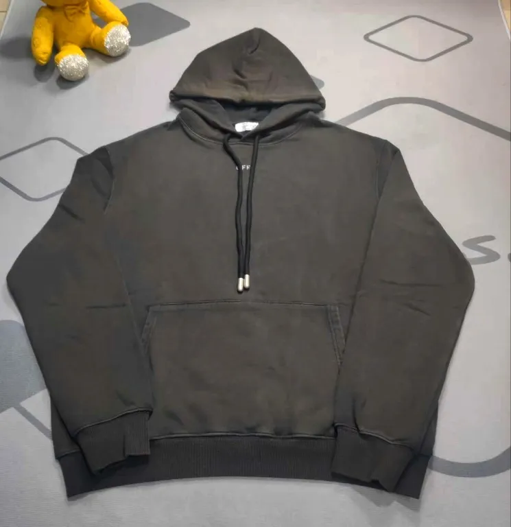 The top proven version OFF back light-up moon WHITE hooded sweatshirt OW jacket hoodie oversize same style for male and female couples stars. As a street fashion art in the luxury ranks, off white has always attracted many fans with its classic logo and trendy creativity. Not only is it an understanding of fashion, off white also intuitively reflects ♻️ environmental awareness in many works, and treats the world gently.  The kangaroo pocket adopts a special machine crimping process with externally shaped wiring. The brim of the hat is designed with threads, which is the first thing to look at when appraising.   The fabric is made of 480g terry cotton fabric with full drape.  Color: Black Size: XS-L P:430